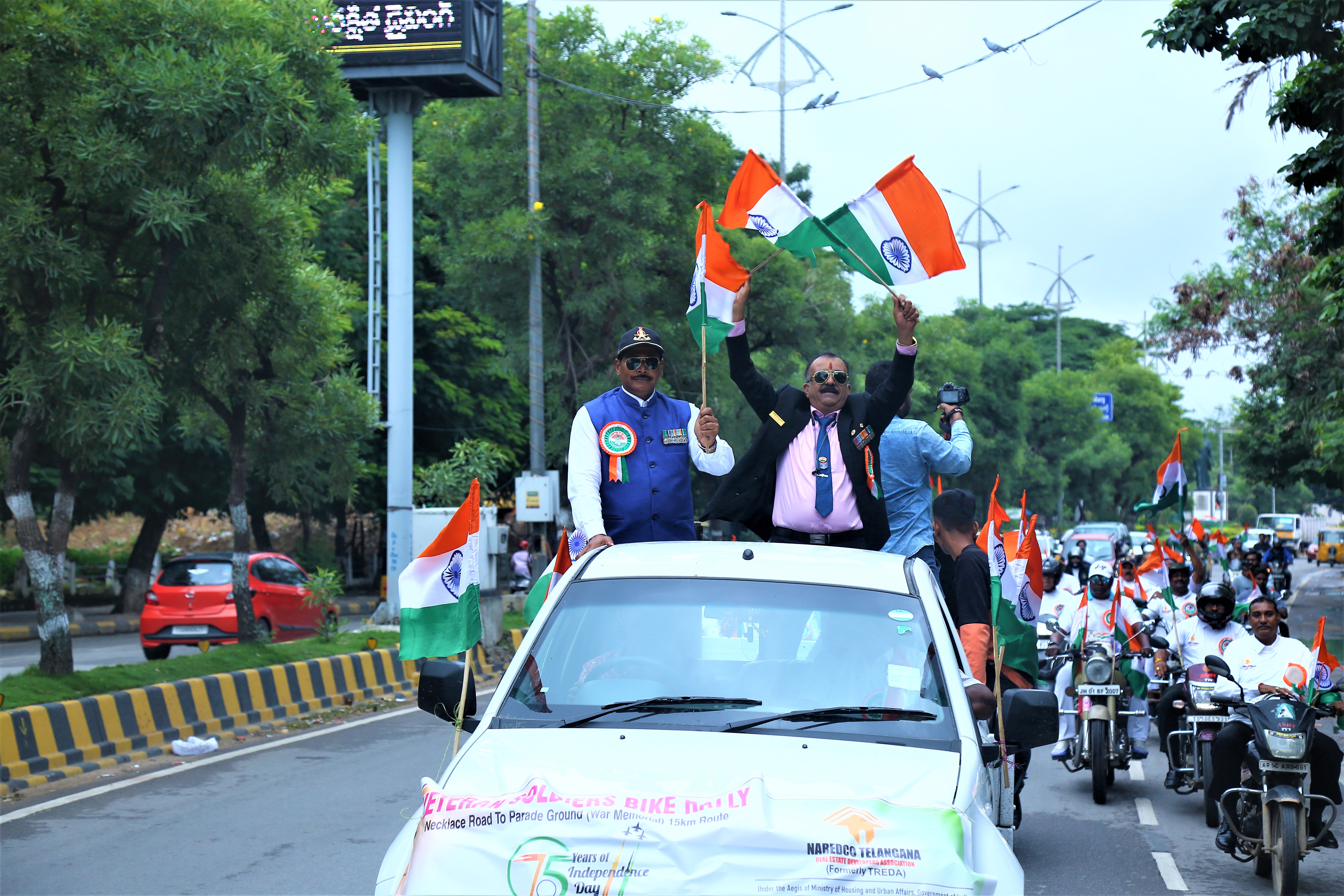 Veteran soldiers leading the bike rally with Indian flags